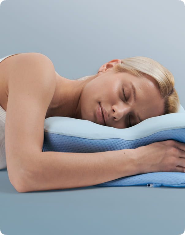 Person sleeping on their stomach on the SmoothSleep pillow