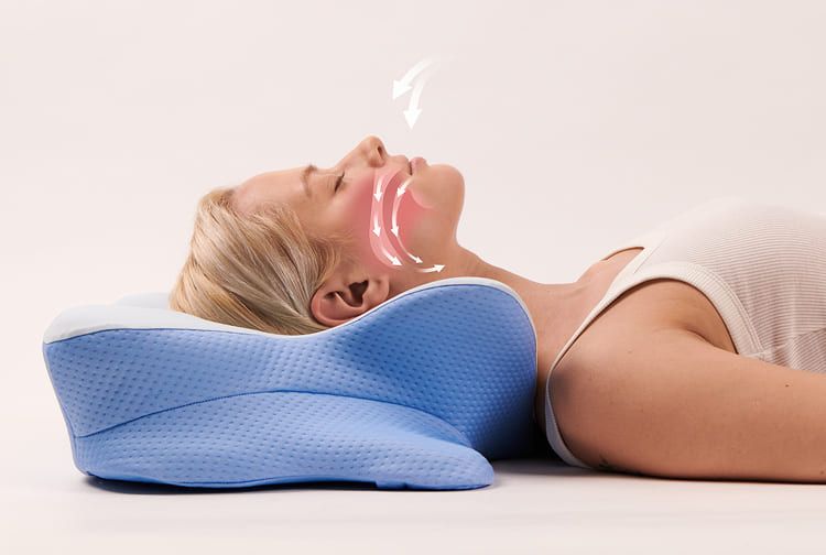 Person resting on the SmoothSleep pillow with the neck supported and the airway open